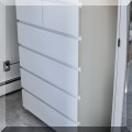 F36. Tall white dresser. 